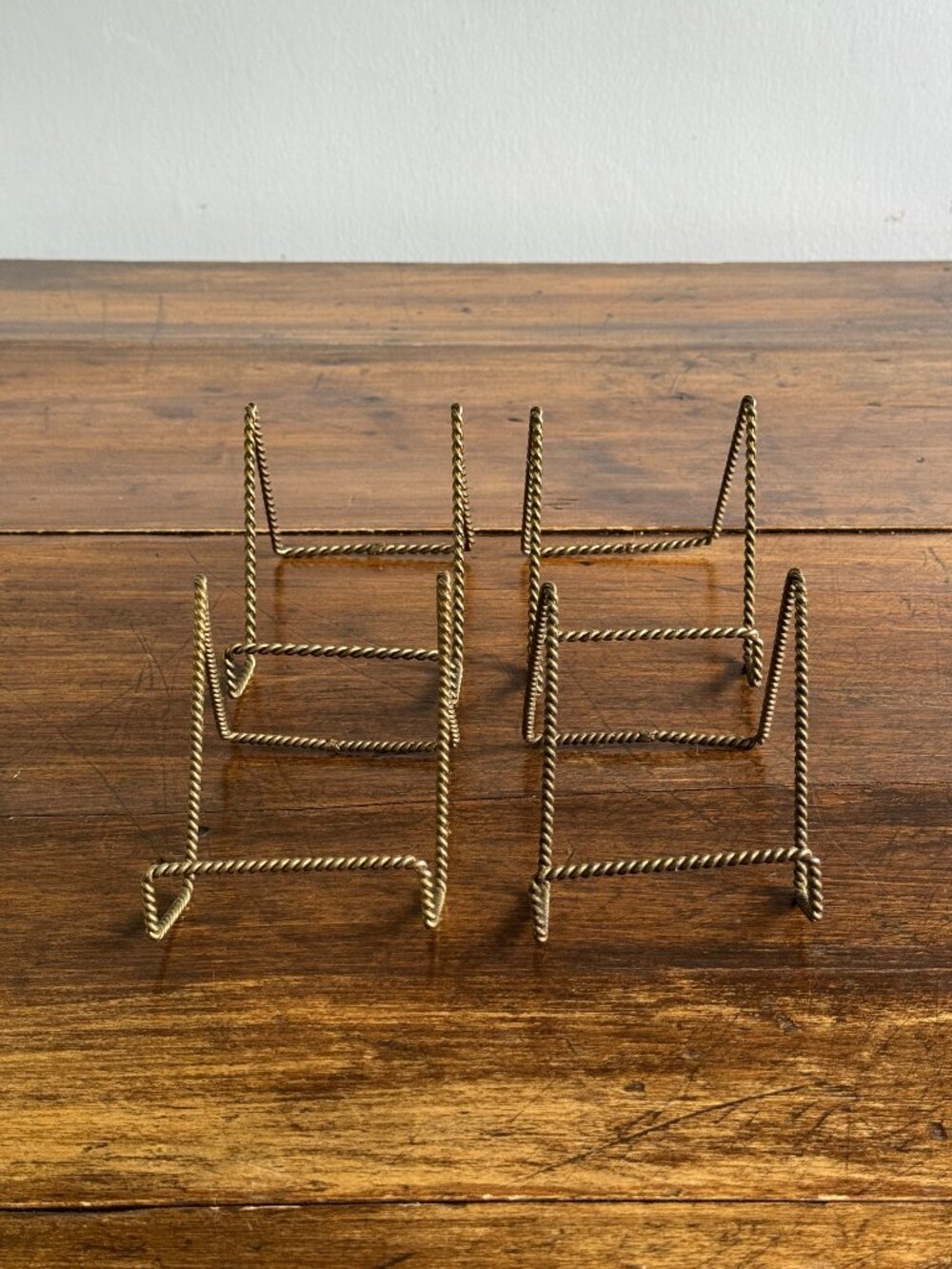 Set of Four Twisted Rope Brass Display Stands